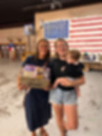 Two women and a baby at a Shreds For Autism event