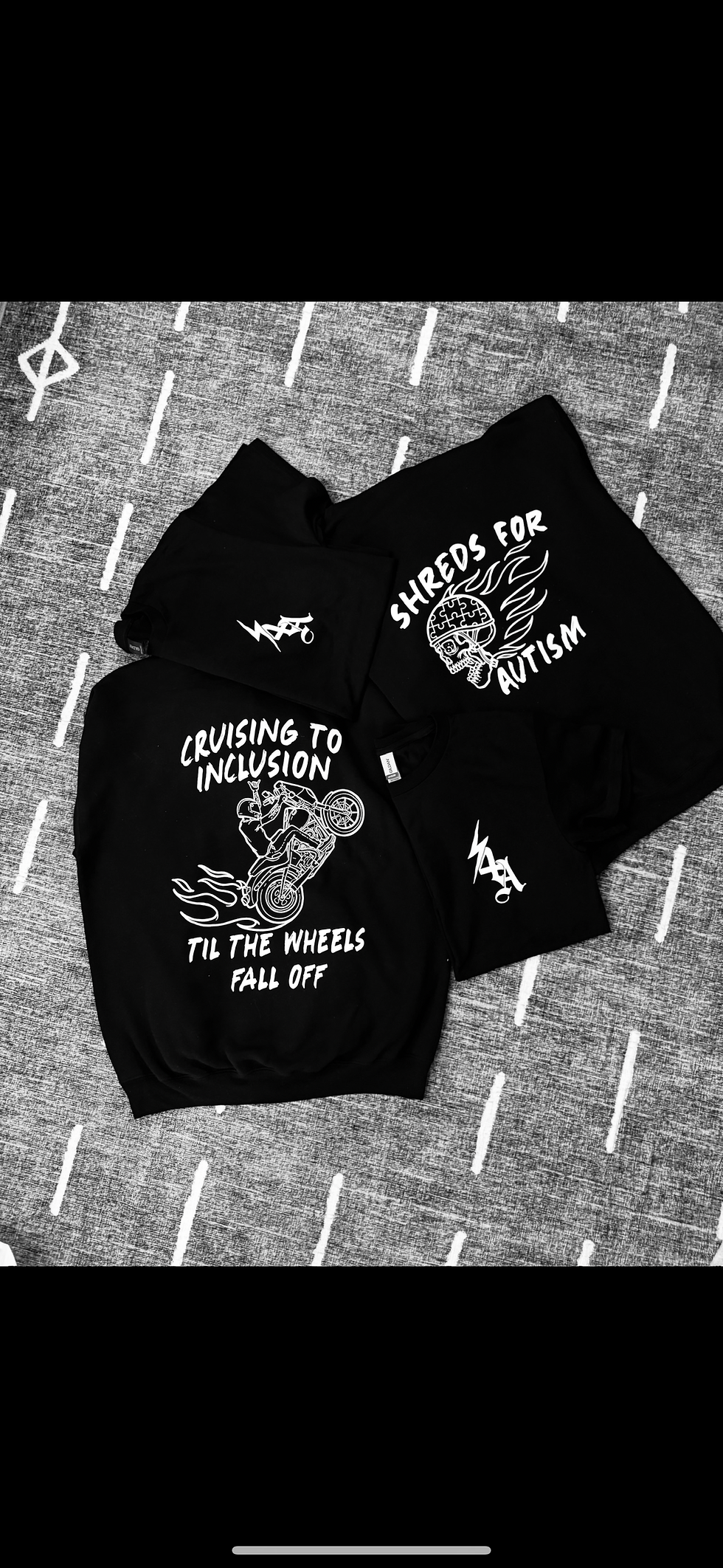Black hoodie with Autism Awareness inclusion graphics.