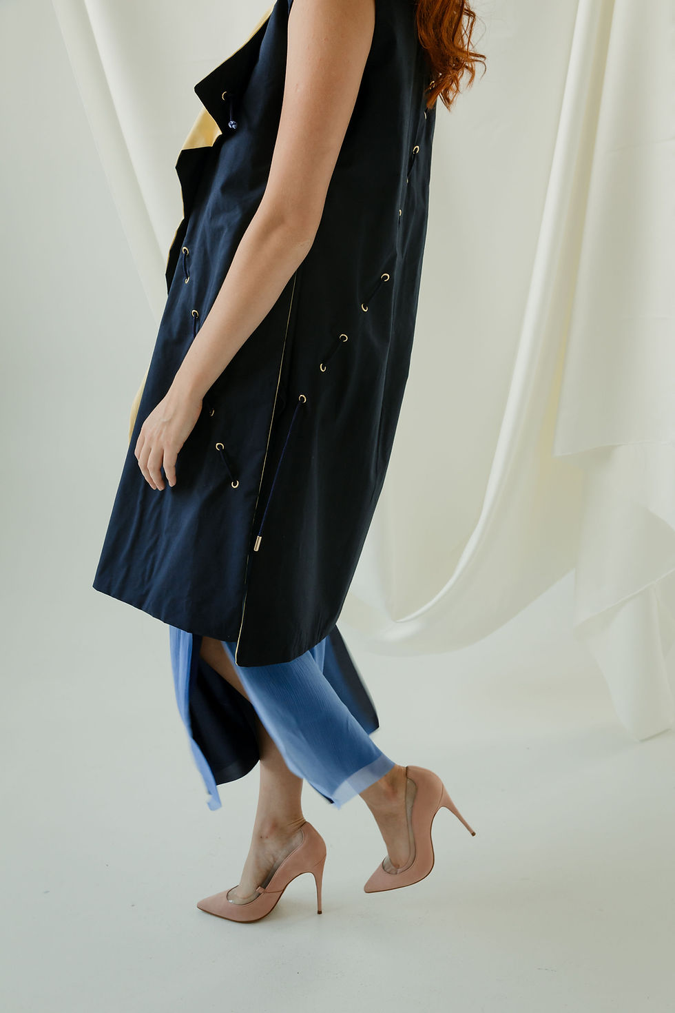 Thumbnail: Side view of the navy and yellow Regina Vest, showcasing the slits and side details.