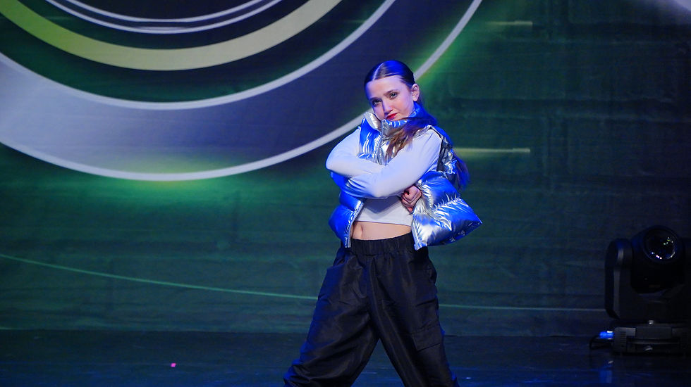 Students performing hip hop at a performance.