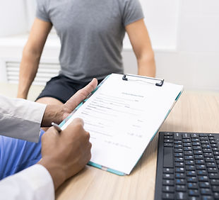 clinician-holding-pen-over-medical-document-while-2026-03-09-02-59-42-utc.JPG