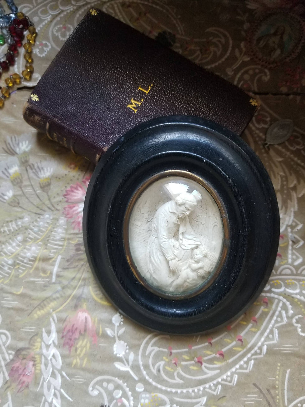 French antique St Vincent de Paul rescuing a baby in Paris meerschaum in black frame.