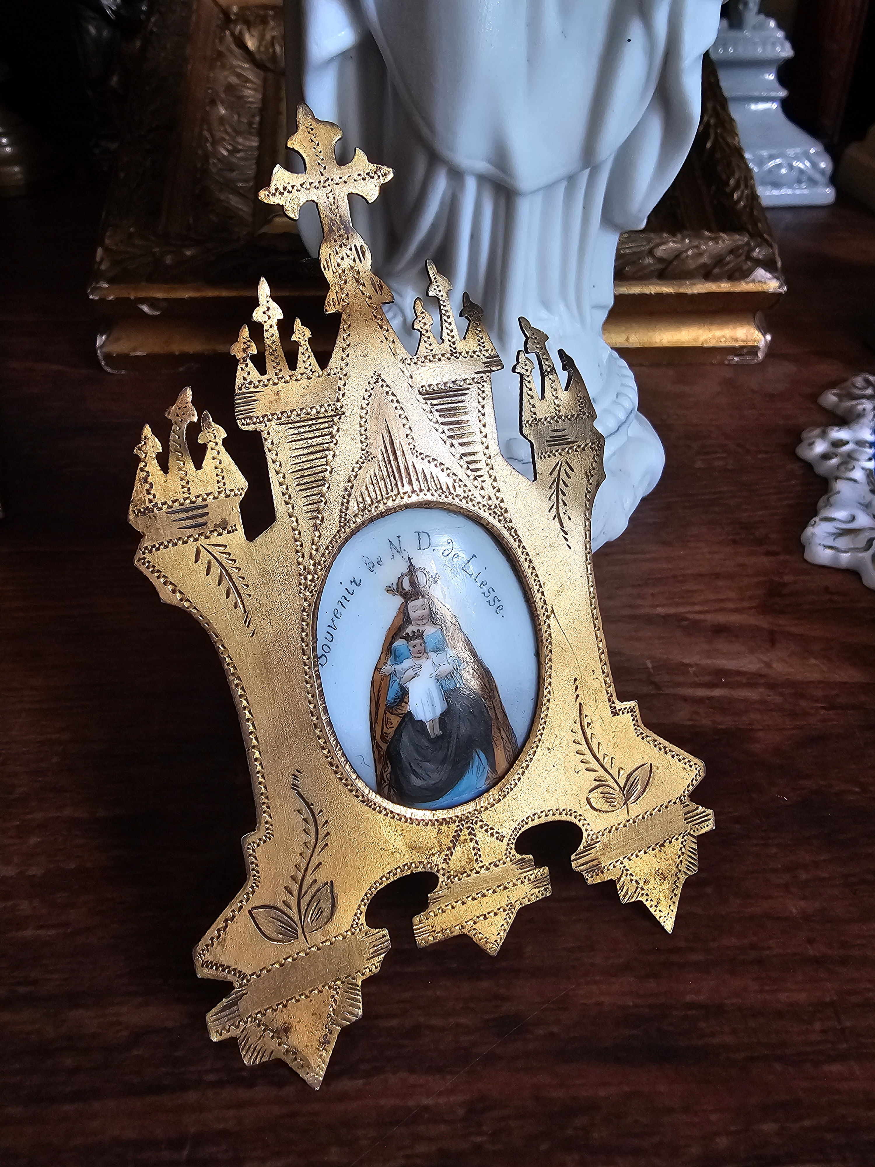 Antique metal frame with Our Lady of Liesse painted porcelain medallion