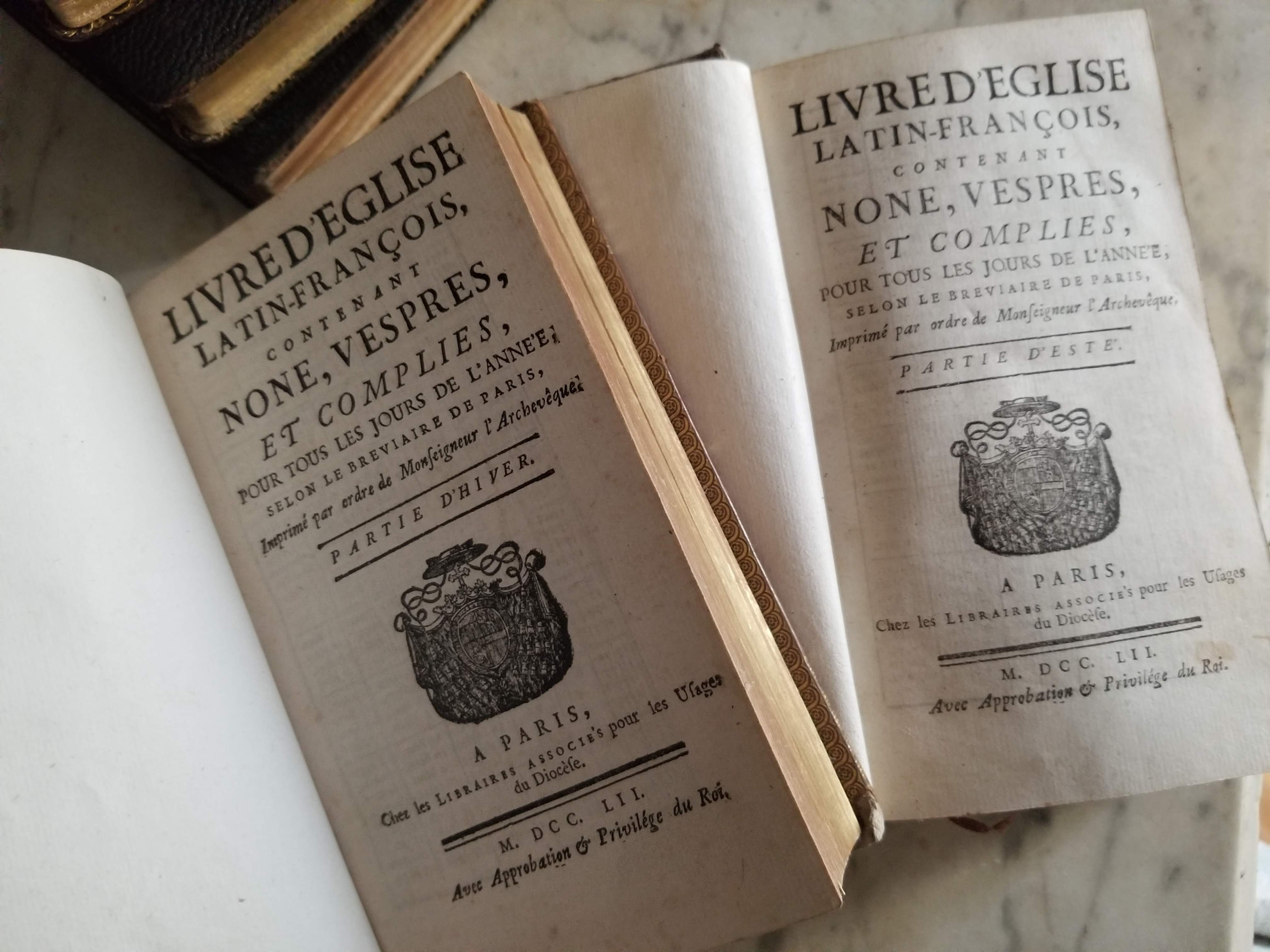 Two antique church books in French and Latin from 1752 for summer and winter