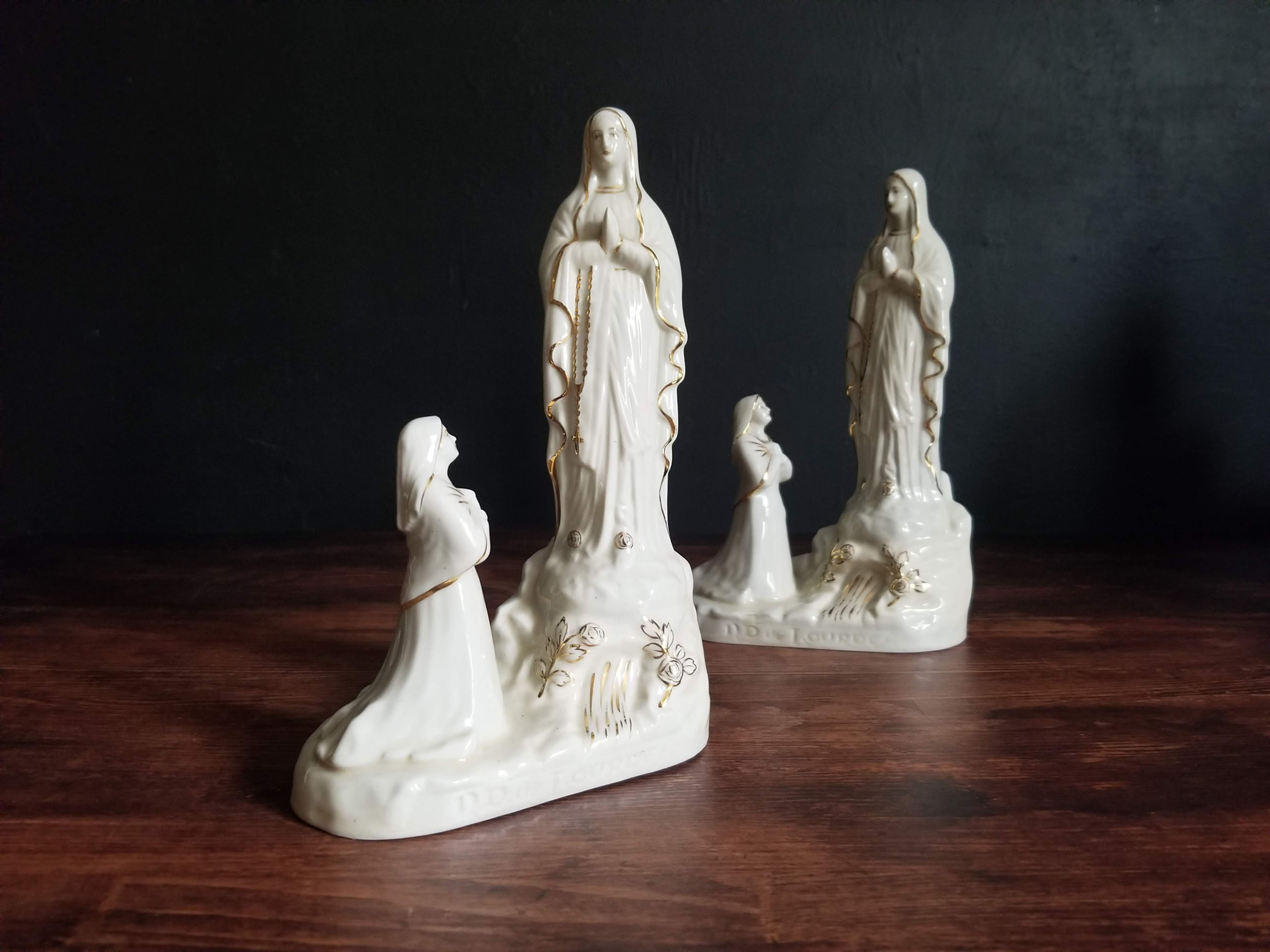 Antique French porcelain statue of the Virgin Mary and Bernadette in Lourdes.
