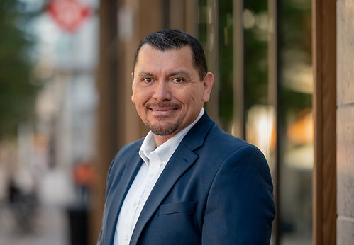 Adrian Chavez, Leadership Coach and Founder of Chavez Coaching Strategies, smiling in professional headshot