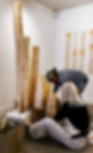 Two artists working installing fabric art sculpture
