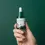 Thumbnail: Hand holding Round Lab Pine Calming Cica Ampoule