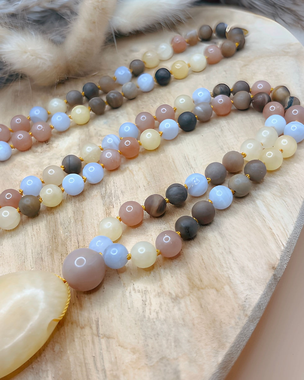 Miniaturbild: Mala "Lichtbringer" Chalcedon Sonnenstein versteinertes Holz Calcit Trommelstein