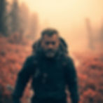 Surreal infrared photograph, warm golden hour light, a man with rugged features in a techn