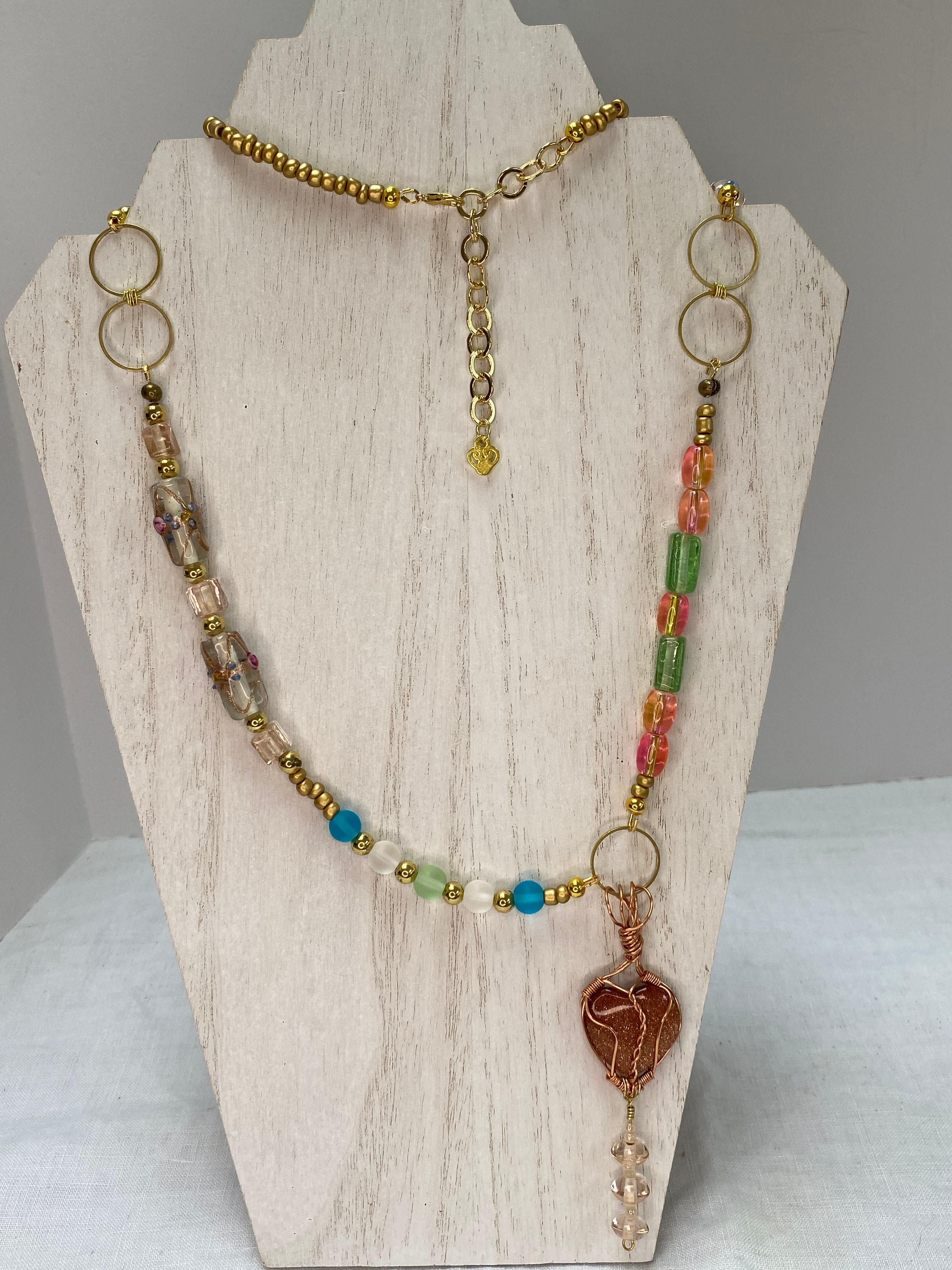 32" pastel and gold beaded necklace with heart charm