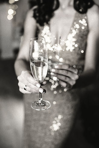 Woman in party dress serving champagne, boutique event planning in Scottsdale