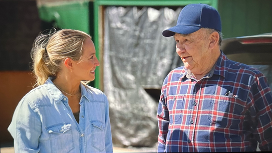 Young woman and older man having a seemingly happy conversation