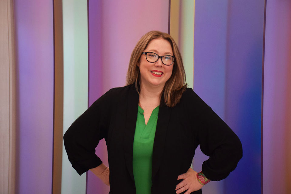 image of Beth Baltes smiling and posing with hands on her hips