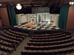 Harvey Completed Set Photo (2)
A completed set photo featuring static walls, two walls on turntables, and a door that was capable of being opened and closed from backstage.
Photo credits: Wesley Carney