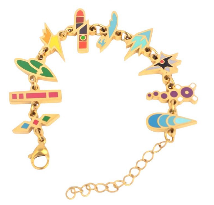 A gold-plated enamel charm bracelet with 10 different charms