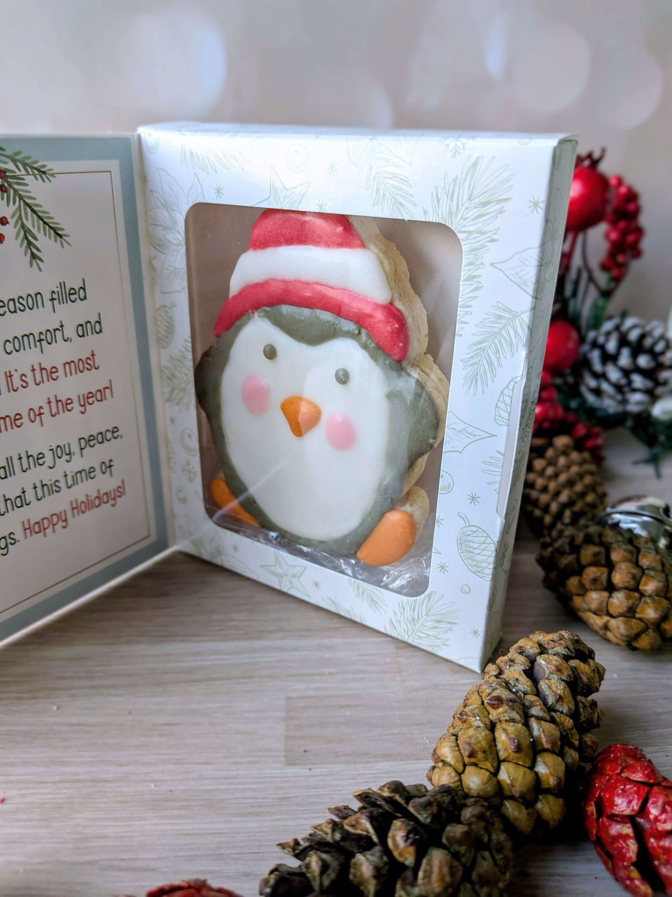 Holiday cookie card featuring a dye-free decorated penguin cookie with a Santa hat, packaged for gifting