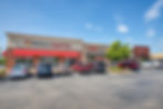 Piedmont Urgent Care storefront, Now Hiring sign, parking lot
