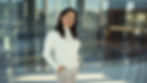Aliss Wang, Smiling woman in white top, hands in pockets
