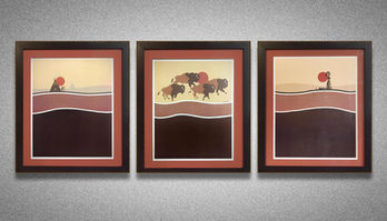 Three bison paintings framed on a wall, brown, black, and red colors.