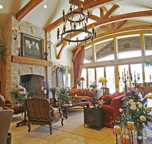 Picture of a custom living room with high ceilings.
