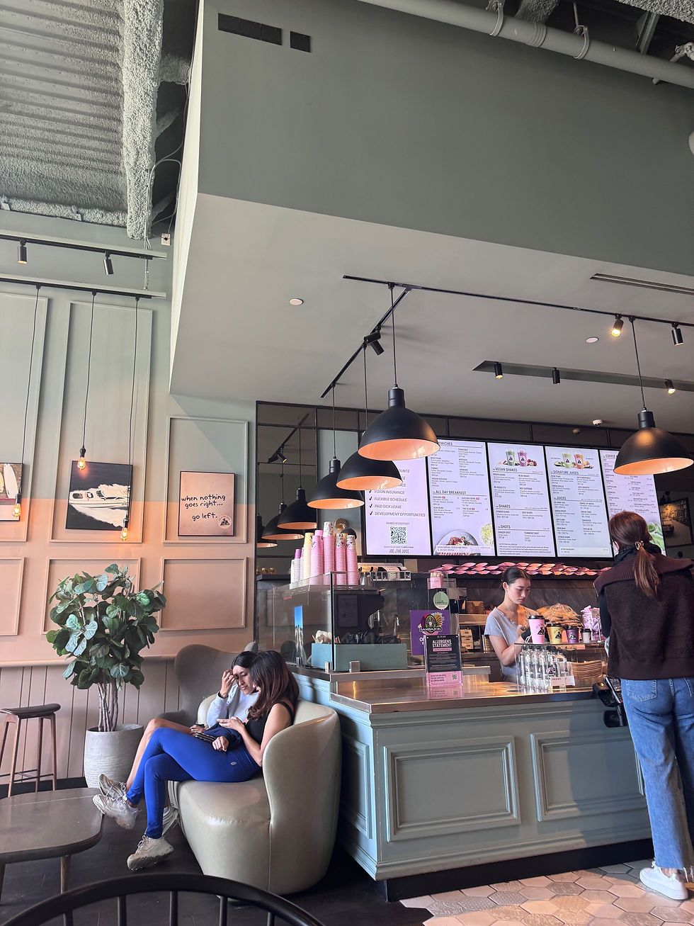 The counter for ordering at Joe and The Juice and a couch with two women chatting