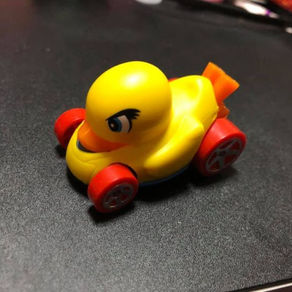 He is yellow and has wheels and looks a little mean