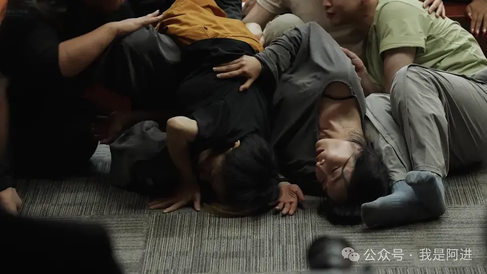 Everyone crawls from the stage onto the carpet while Naye’s body pushes me forward.
