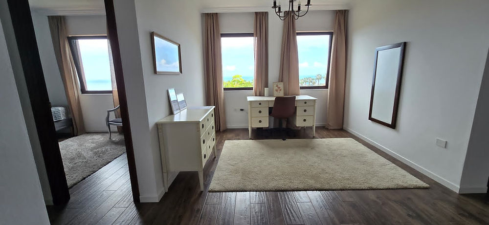 Bright, elegant room in The Villa with large windows.