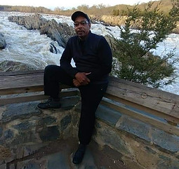 Business Owner sitting on a wall