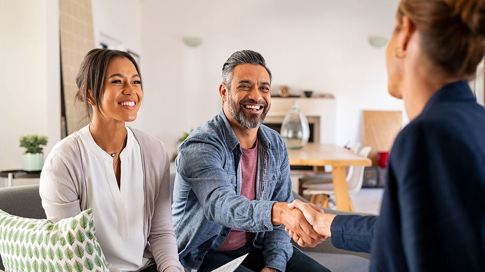 Smiling couple meeting with a financial advisor to discuss tax planning and retirement strategies
