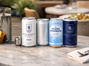 Aluminium canned spring water displayed on table representing sustainable water packaging in Australia