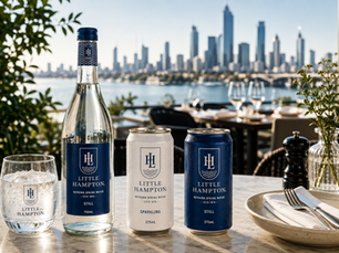 Premium Australian spring water bottles and recyclable aluminium cans displayed in a luxury waterfront hospitality setting for wholesale and private label supply.