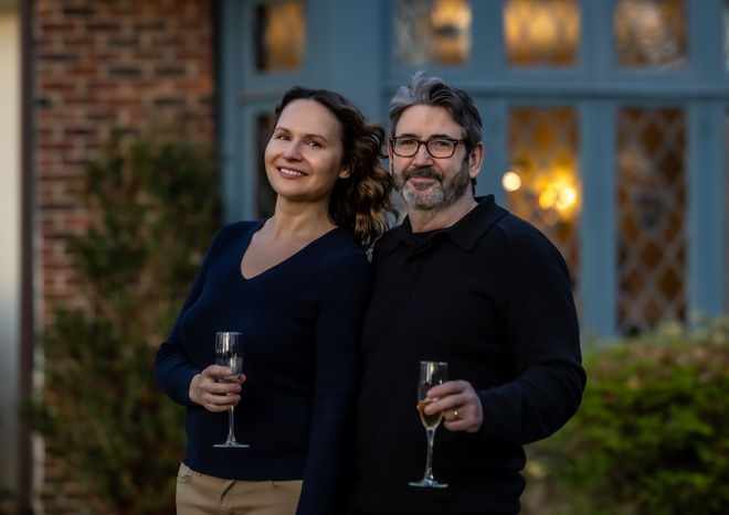 Couple posing together outdoors during a lifestyle couples photography session in Westchester New York