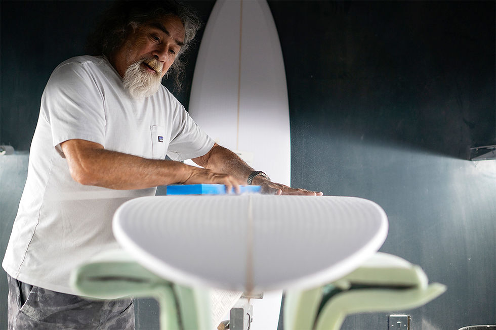 maurice cole shaping a surfboard