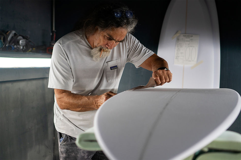 maurice cole shaping a surfboard