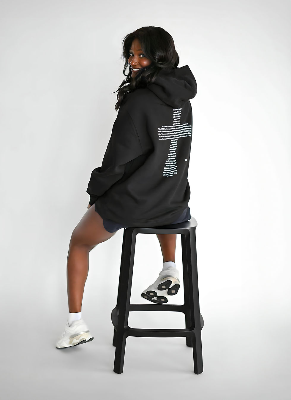 Woman modeling The Eternity Hoodie, highlighting the comfortable fit and meaningful faith-based graphic.