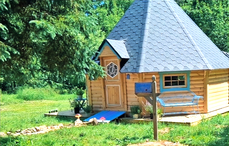 Side view of the new Harmony Way Healing Hut and Sign