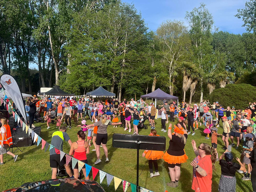 Participants warming up before the start of the 2025 Butterfly Fun Run