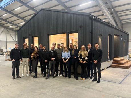 MyCabin team infront of Living 80 house