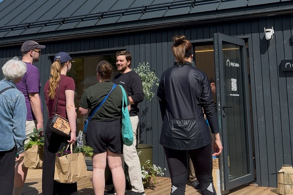 MyCabin sales representative with customers on an open day