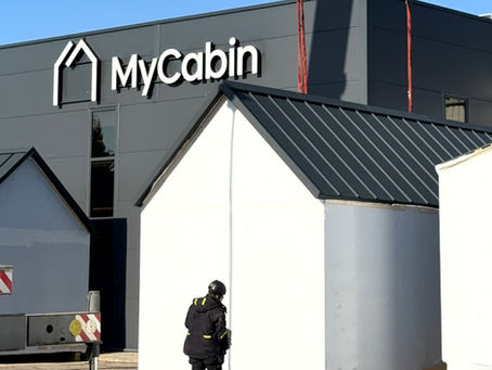 MyCabin house infront of the MyCabin factory