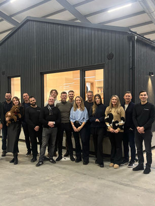 MyCabin team in front of new Living 80 house