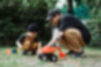 parent and child play with outdoor toys.jpg