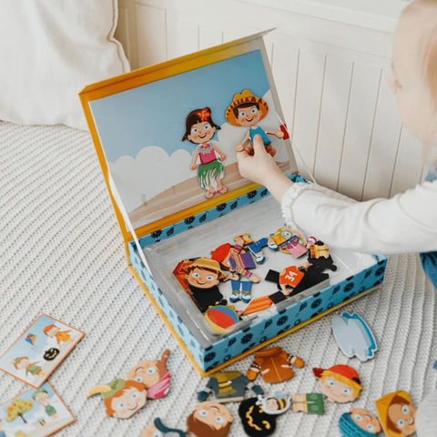 Child plays with magnetic dress up toys