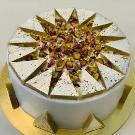 Exquisitely decorated Indian-inspired cake showcasing traditional flavors and designs.