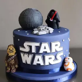 Bold and tastefully decorated cake designed for a man's celebration.