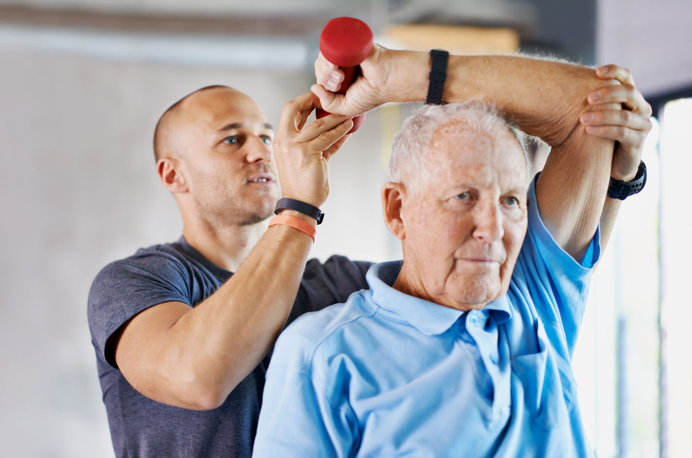 An elderly gentleman receives physio
