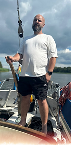 Dan from DSG Services standing on a boat.