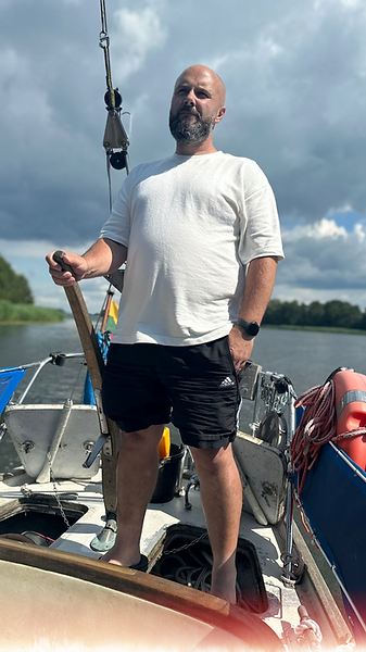 Dan sailing a yacht